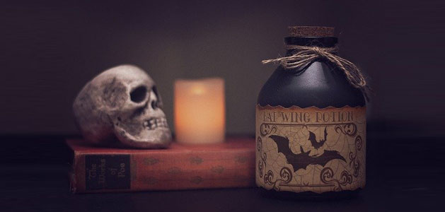 image of spooky skull and poison bottle